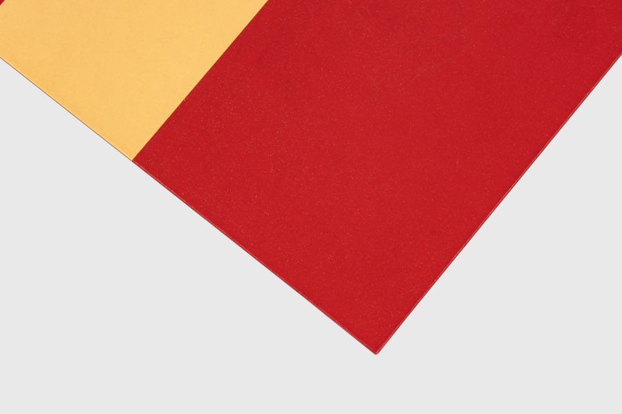 Close-up of a card corner with matte lamination showing a smooth, low-glare surface