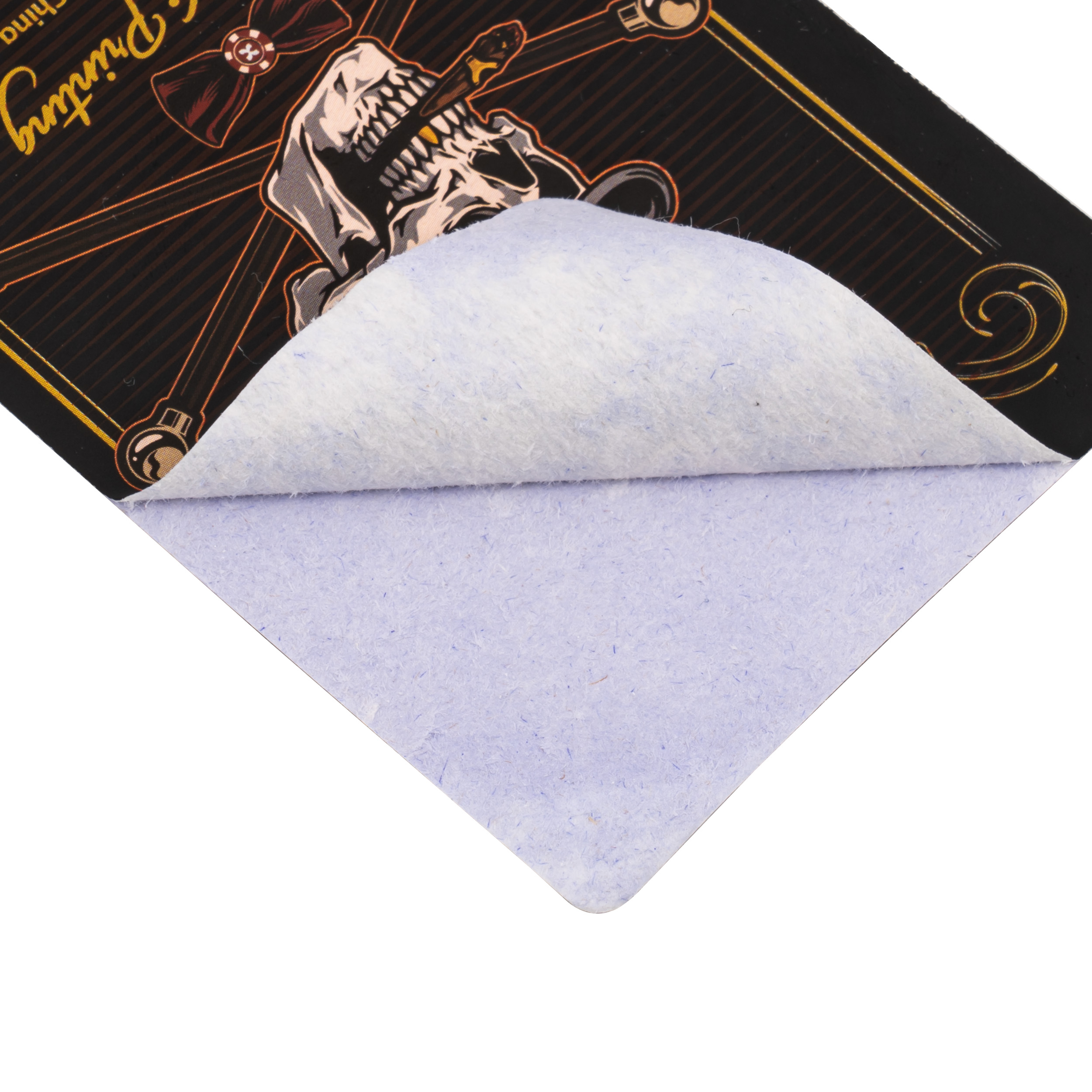 Torn corner of a printed card revealing the blue light-blocking core layer