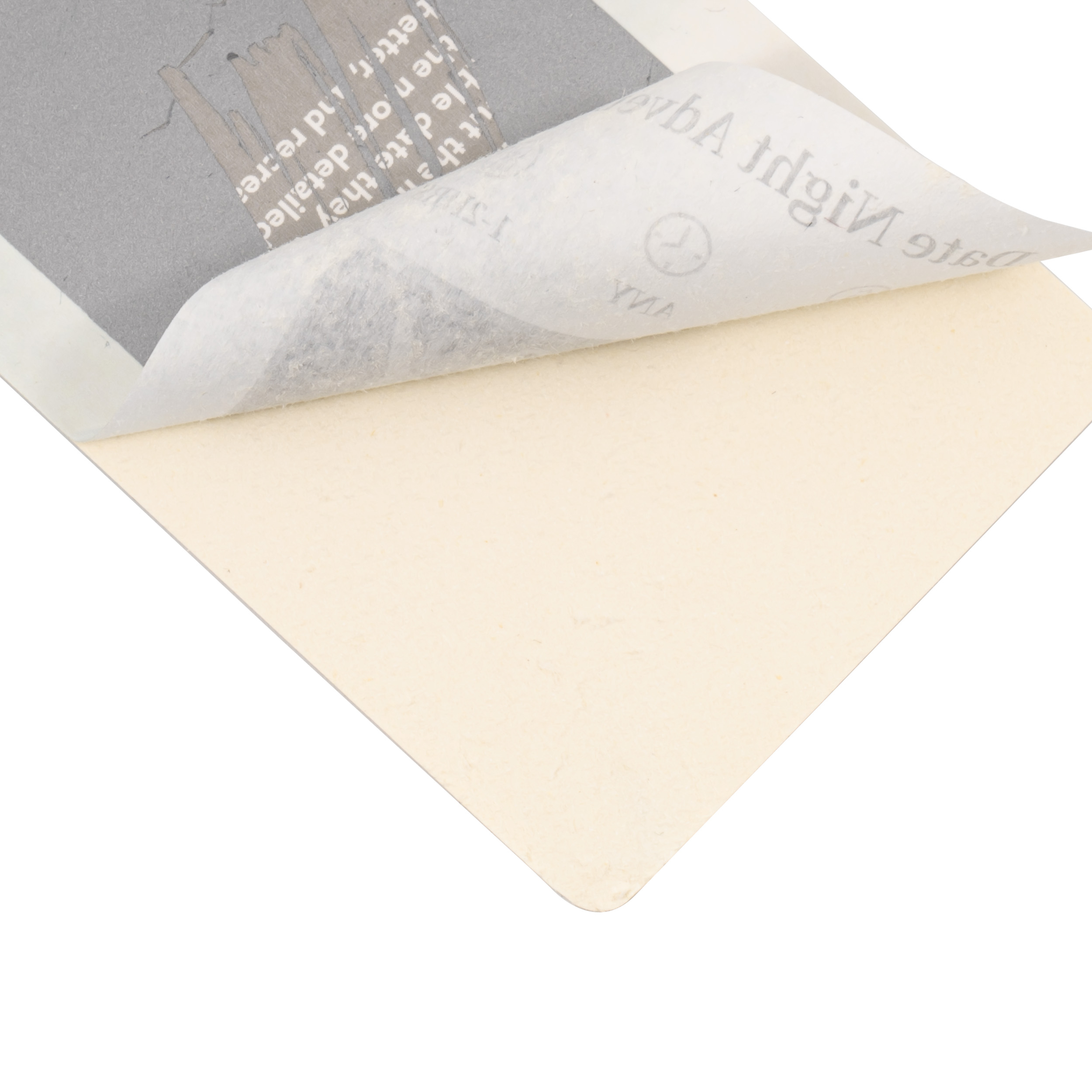 Printed sheet lifted from a cream card sheet, with reversed text visible through the top layer